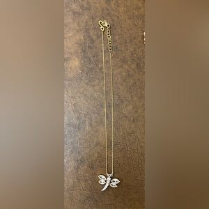 Costume Gold colored chain and Crystal type dragonfly . 9” diameter.